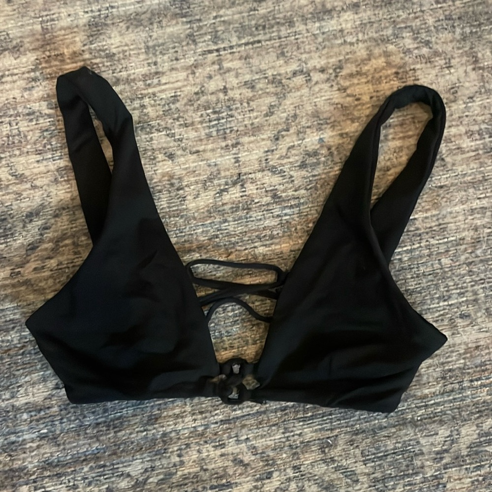 Black bikini top. Could fit women xxs or a kids large/ extra large/ medium.
